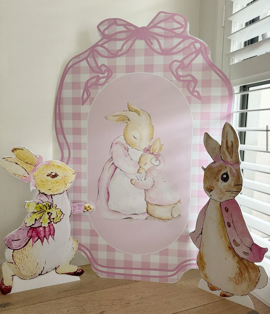 Pink Peter Rabbit arch backdrop with bows for baby shower by Paper n Co Melbourne
Pink Peter Rabbit foam board backdrop with ribbon accents
Peter Rabbit first birthday pink arch set printed on foam board