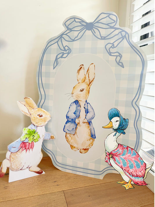 Peter Rabbit arch backdrop with bows in pastel tones by Paper n Co Melbourne
Peter Rabbit baby shower foam board backdrop with ribbon bow details
Peter Rabbit first birthday arch set in blue and beige palette